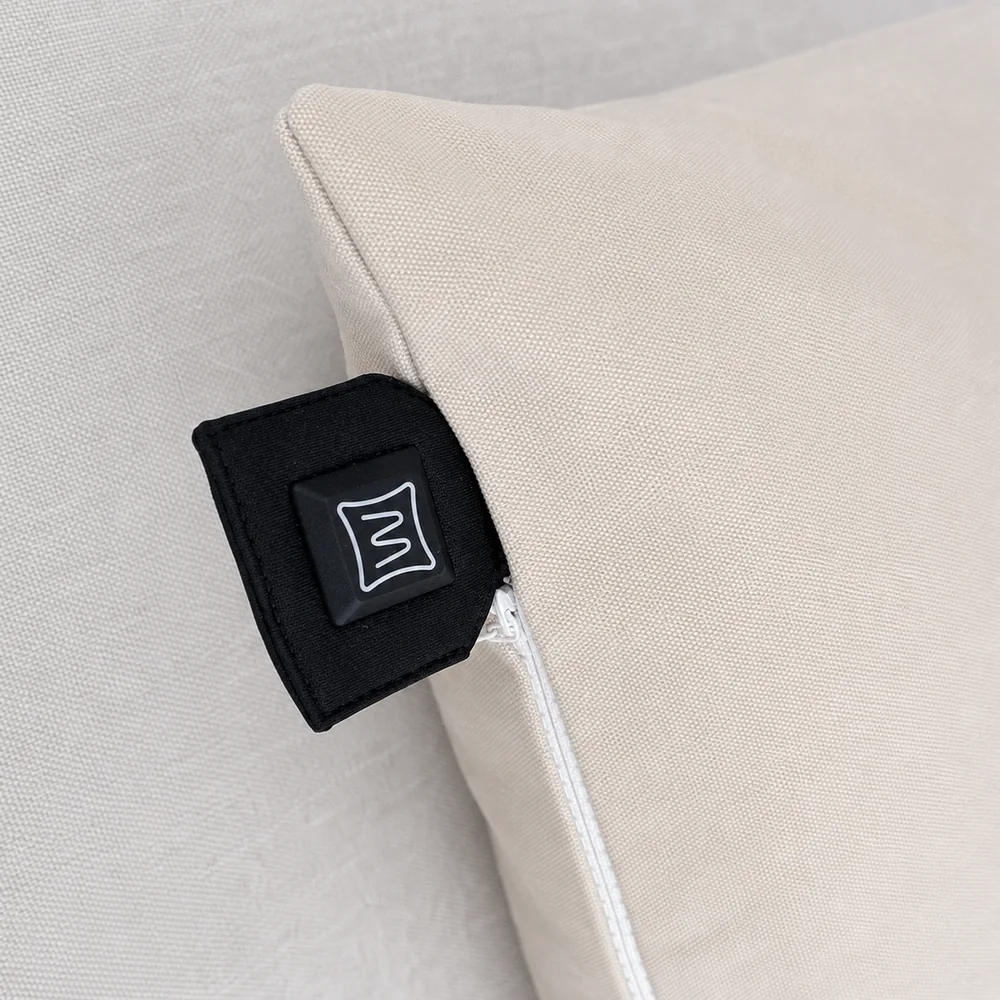 Warmpi heated inner cover control button accessible beside a decorative cover zipper